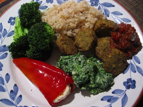Brown rice, falafel, yoghurt and spinach, broccoli, stuffed red pepper